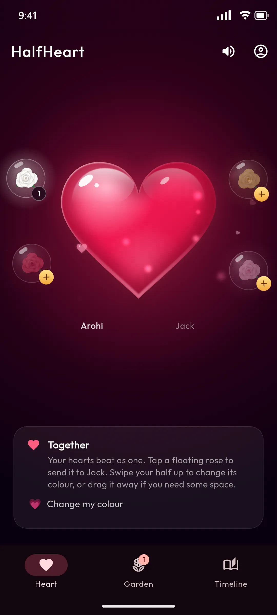 HalfHeart main screen: a glossy ruby heart, whole, with roses floating around it ready to send